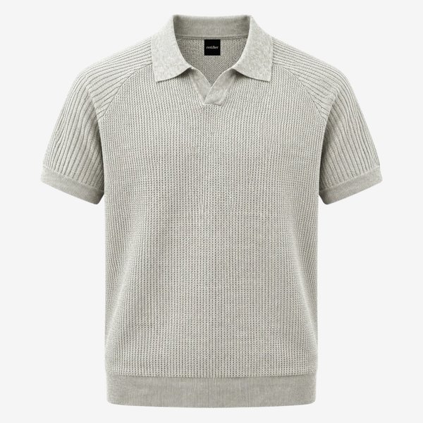 A light gray knit polo sweater with a textured waffle pattern, ribbed collar, and short sleeves, shown against a plain light gray background.