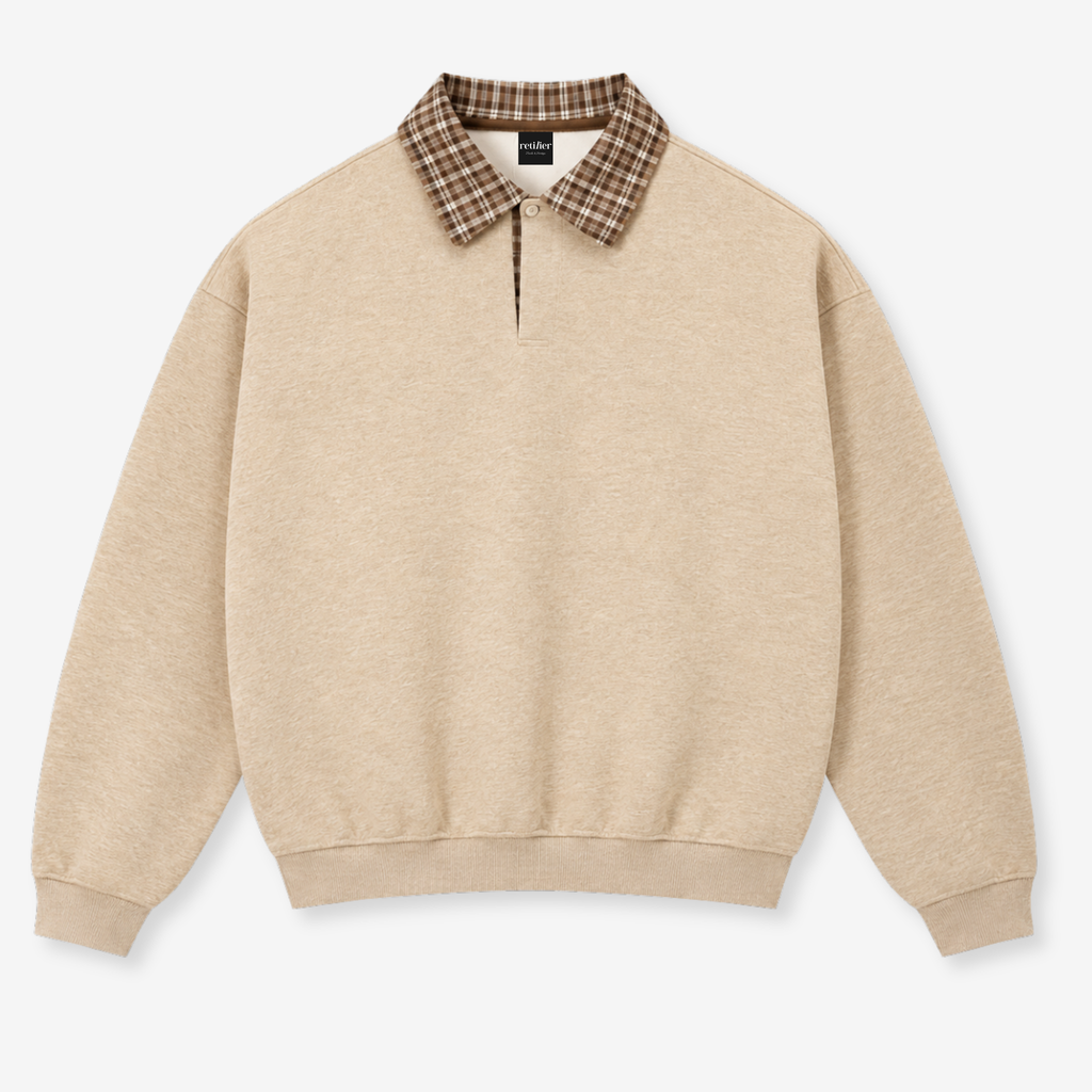A beige crewneck sweatshirt featuring a brown and beige plaid collar, displayed flat against a light gray background.