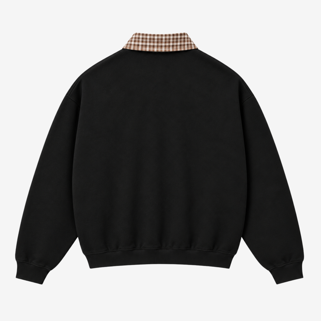 A black crewneck sweatshirt shown from the back, featuring a brown and beige plaid shirt collar detail, photographed against a light gray background.