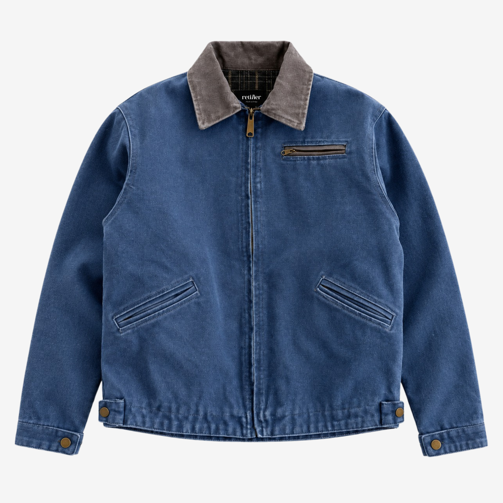 An off-white canvas utility jacket with a contrasting dark brown corduroy collar, featuring a front zipper, zippered chest pocket, and two diagonal zippered hand pockets.