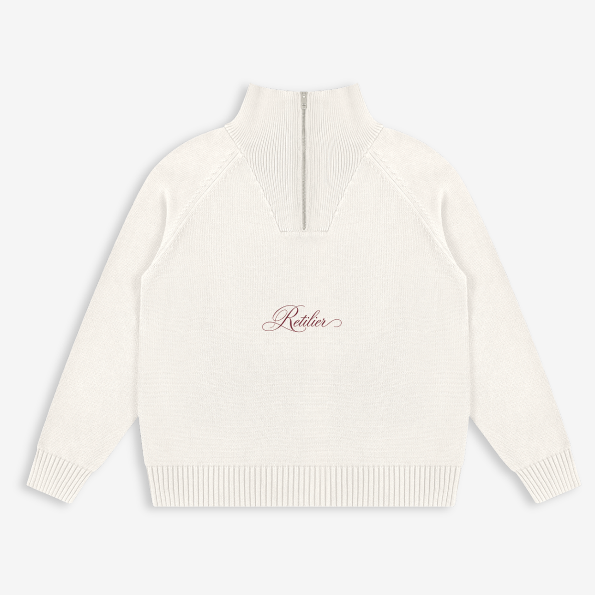 An off-white knit mock neck sweater with a center zipper and a small cursive 'Rothier' logo on the chest, displayed on a light gray background.