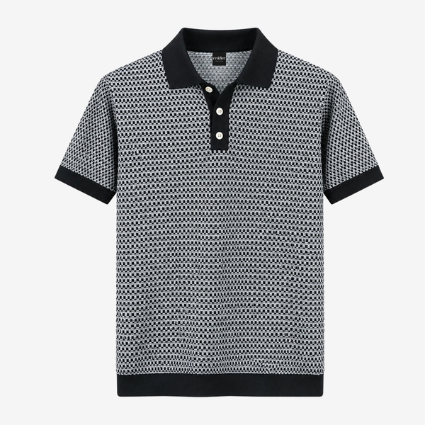 A short-sleeve polo shirt with a black and white geometric pattern, featuring a solid black collar, button placket, and ribbed hem and cuffs, shown against a plain light gray background.